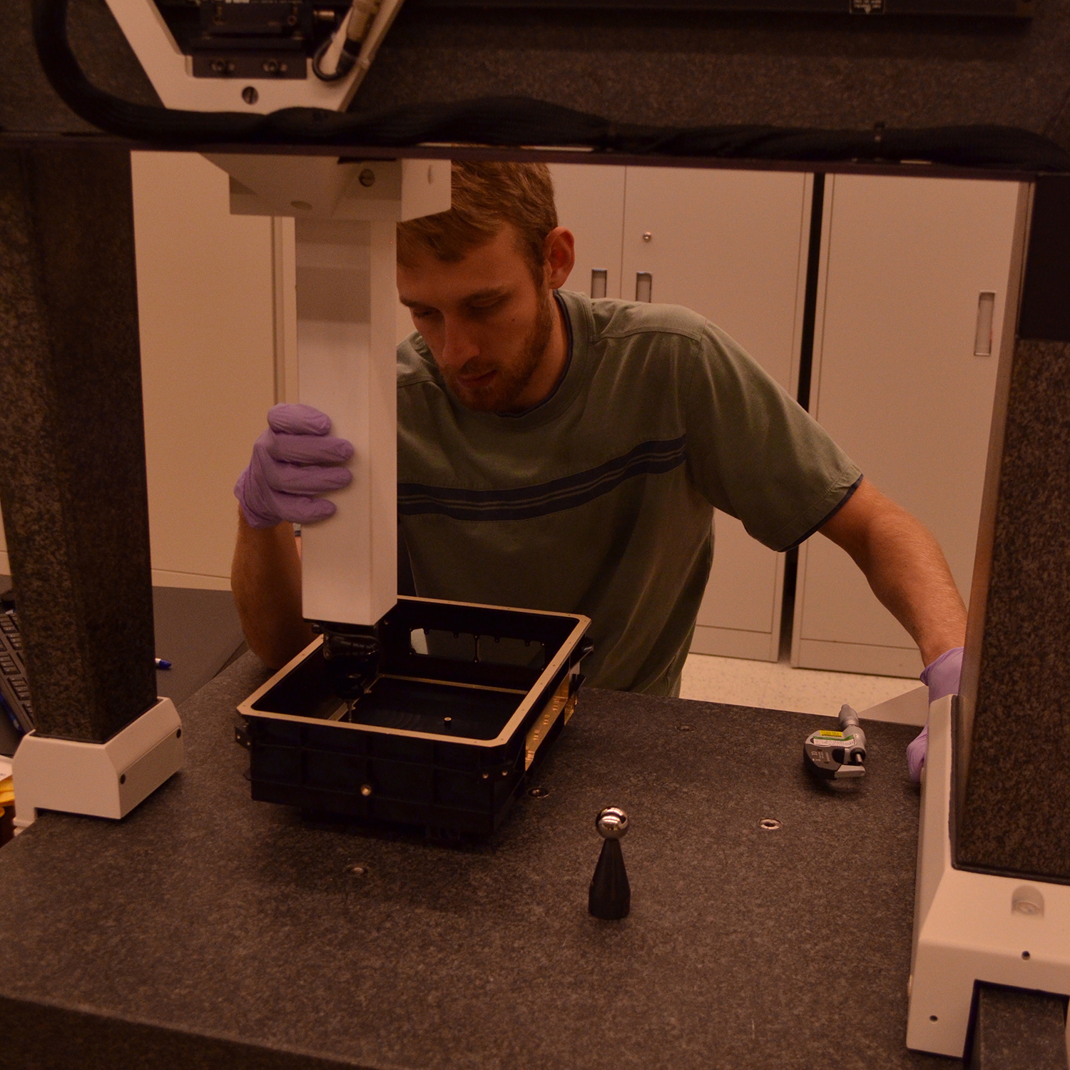 Andrew Holmes (ASU) inspecting LTES Enclosure to make sure it meets specifications.